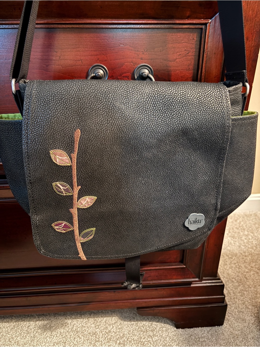 Haiku Black Messenger Bag with Multicolor Leaf Applique